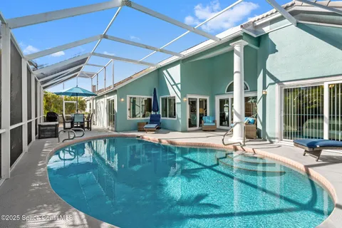 a view of a swimming pool with sitting area