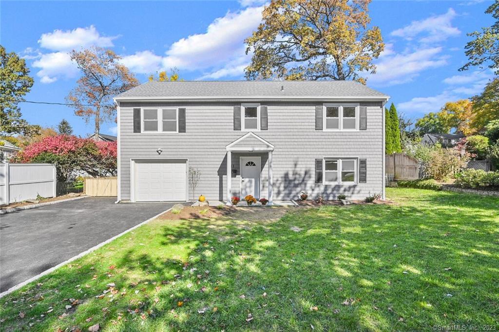 11 Merrill Road Norwalk, CT 06851 - Photo 1 of 1 a front view of a house with a yard and garage