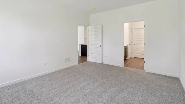 a view of empty room with windows