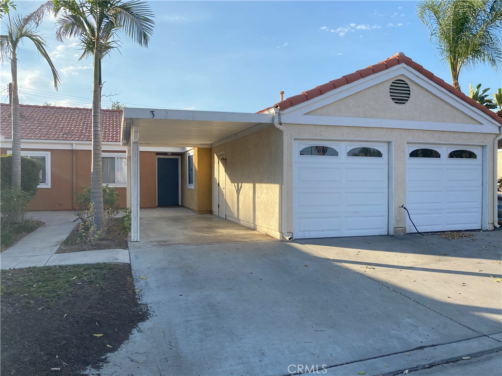 3738 Harrison Street, Unit 3 Riverside, CA 92503 - Photo 1 of 1 a front view of a house with a yard and garage