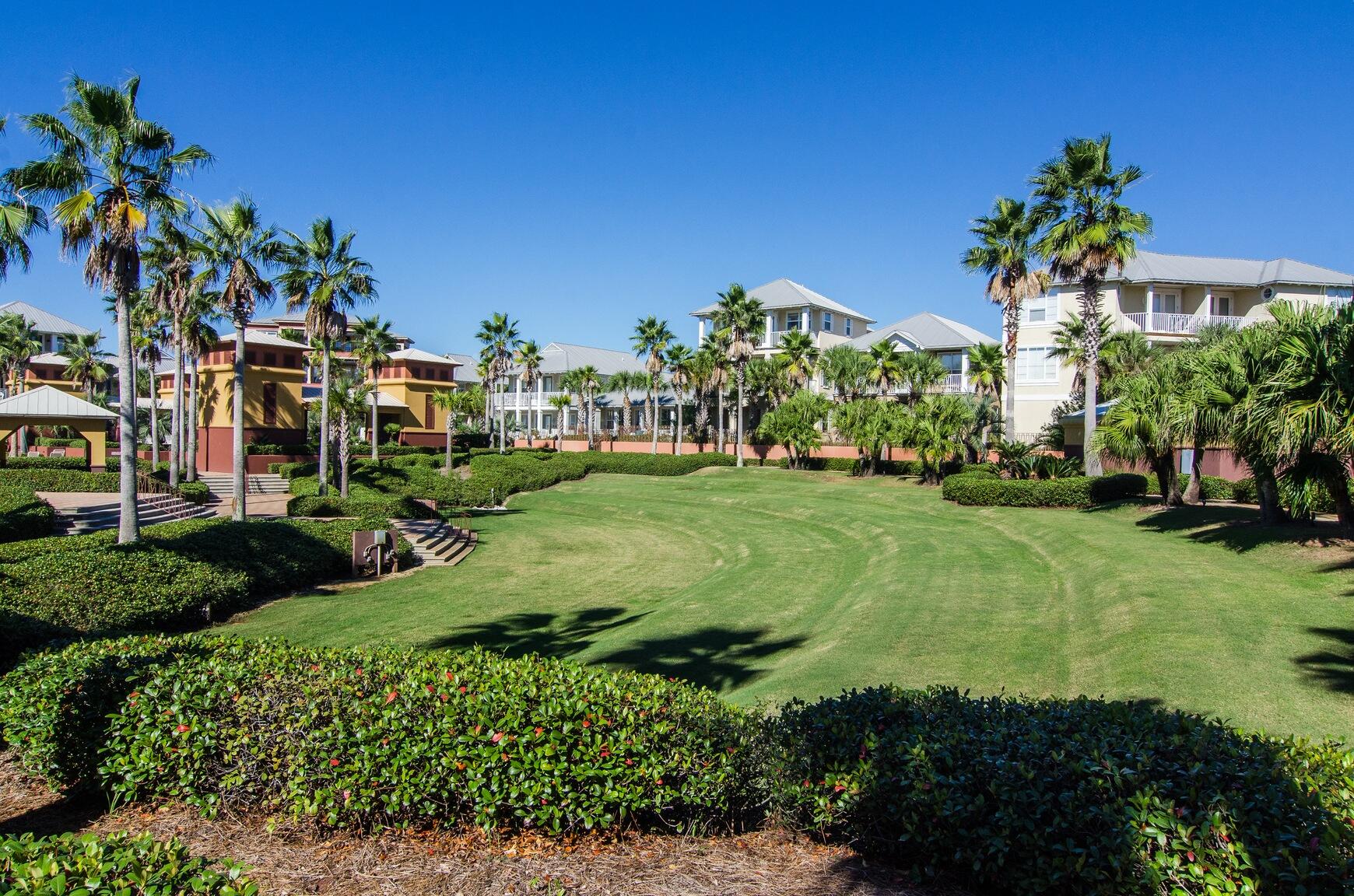 44 East Trigger Trail Seacrest, FL 32461 - Photo 20 of 20 a view of a garden with a building in the background