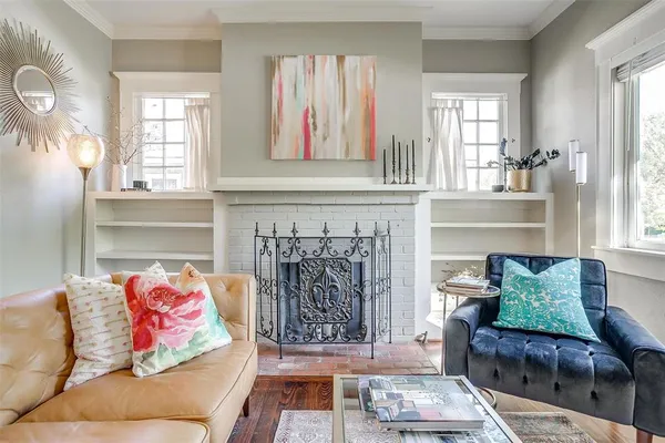 a living room with furniture and a fireplace