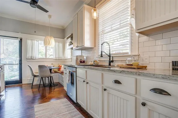 a kitchen with sink cabinets and window