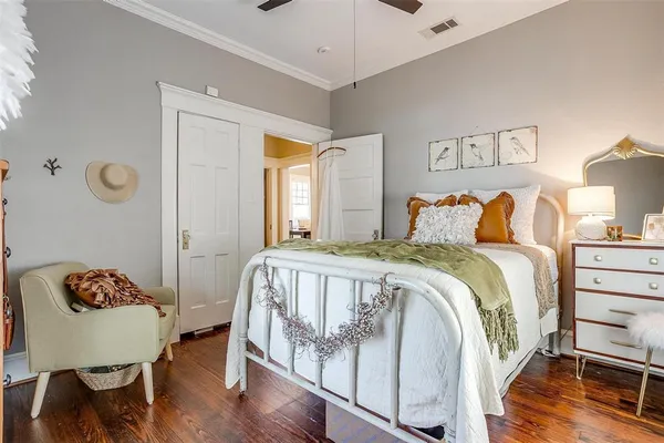 a bedroom with a bed and a lamp
