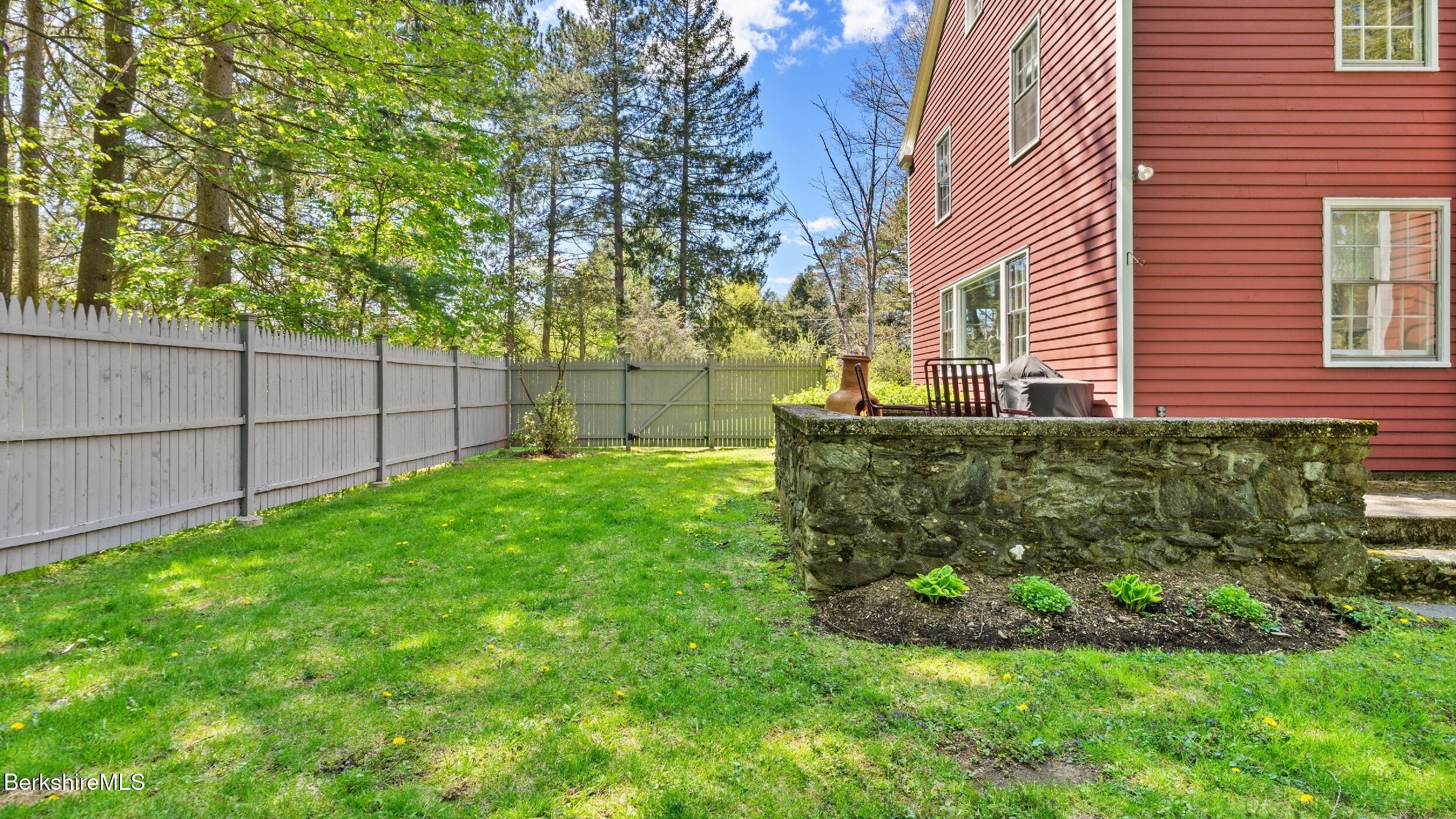 47 Warwick Street Pittsfield, MA 01201 - Photo 37 of 43 Fenced yard with stone patio