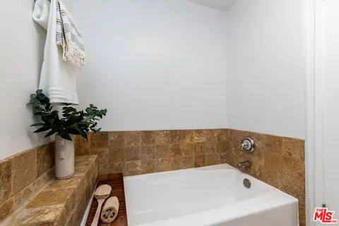 a bath tub sitting in a bathroom