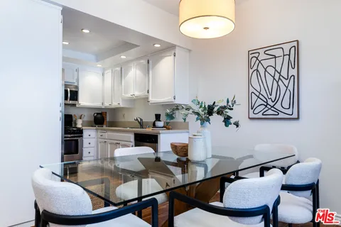 a kitchen with a table and chairs