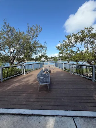 a view of a terrace with wooden floor and city view