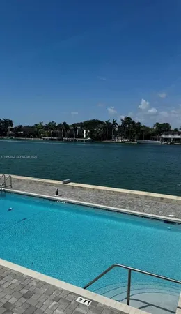 a view of a lake with houses in the background
