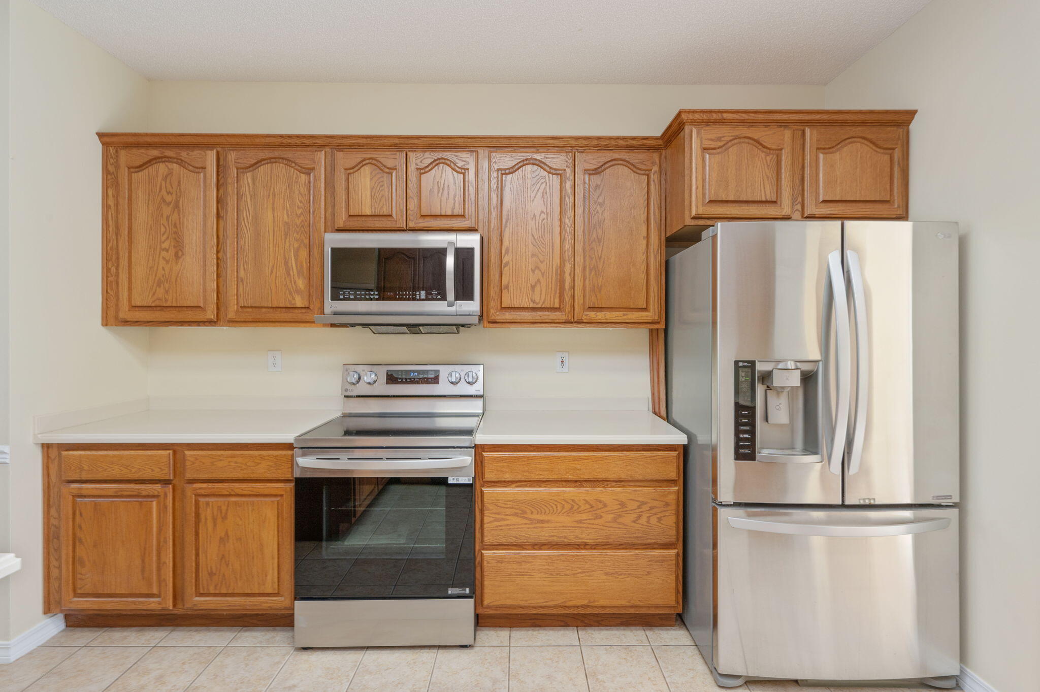 5552 Frontier Drive Crestview, FL 32536 - Photo 17 of 50 a kitchen with stainless steel appliances granite countertop a refrigerator stove and microwave
