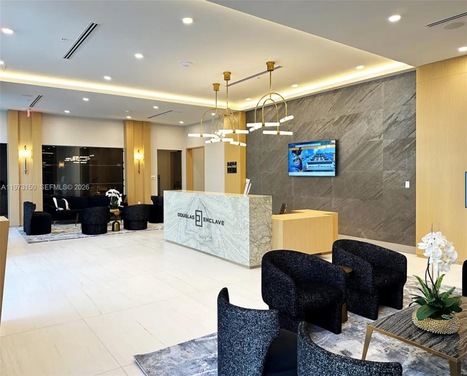 61 Northwest 37th Avenue, Unit 414 Miami, FL 33125 - Photo 11 of 18 a living room with furniture and a chandelier