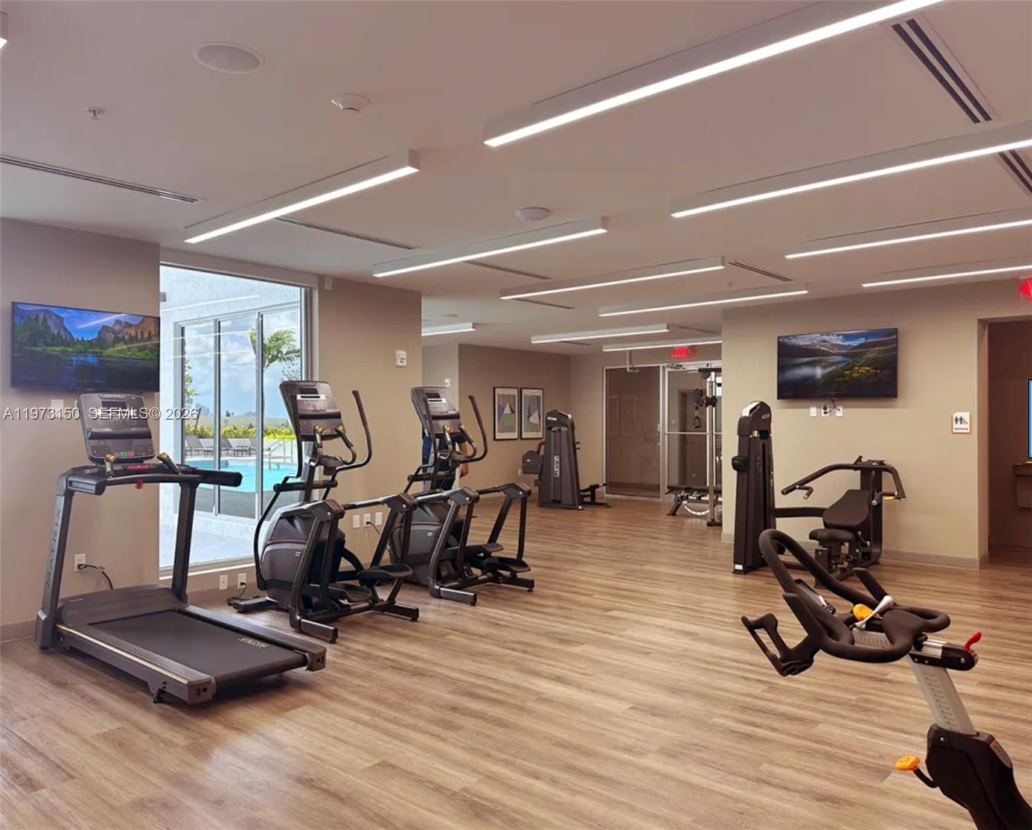 61 Northwest 37th Avenue, Unit 414 Miami, FL 33125 - Photo 12 of 18 a view of a room with gym equipment