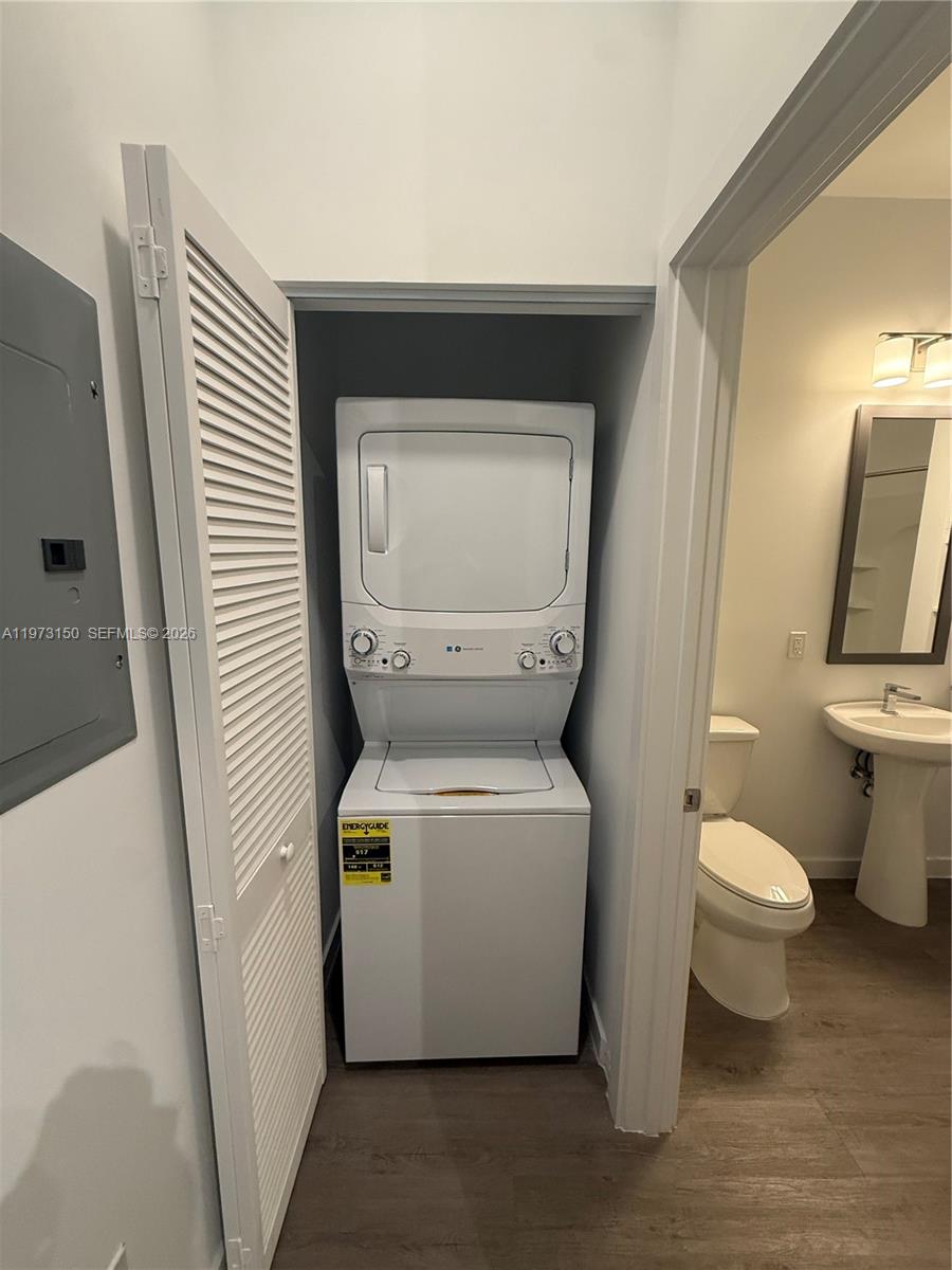 61 Northwest 37th Avenue, Unit 414 Miami, FL 33125 - Photo 9 of 18 a utility room with a toilet and a sink