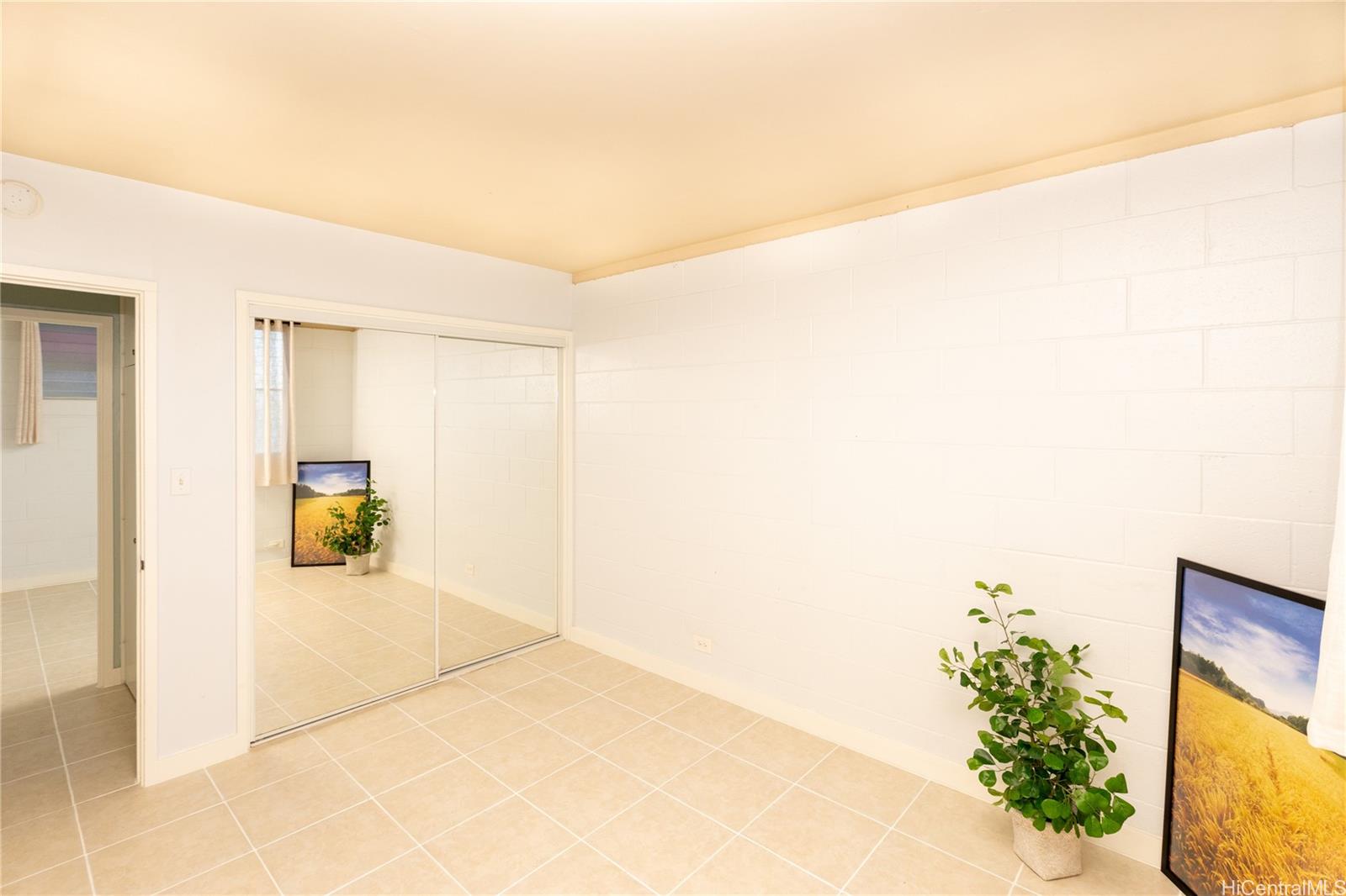 98-135 Lipoa Place, Unit 301 Aiea, HI 96701 - Photo 12 of 17 a view of a hallway to a house