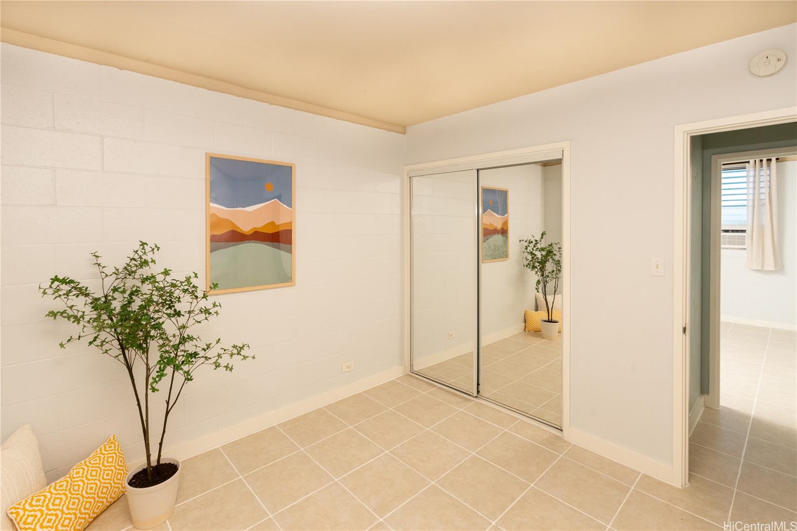 98-135 Lipoa Place, Unit 301 Aiea, HI 96701 - Photo 14 of 17 a view of a room that has a plant in it