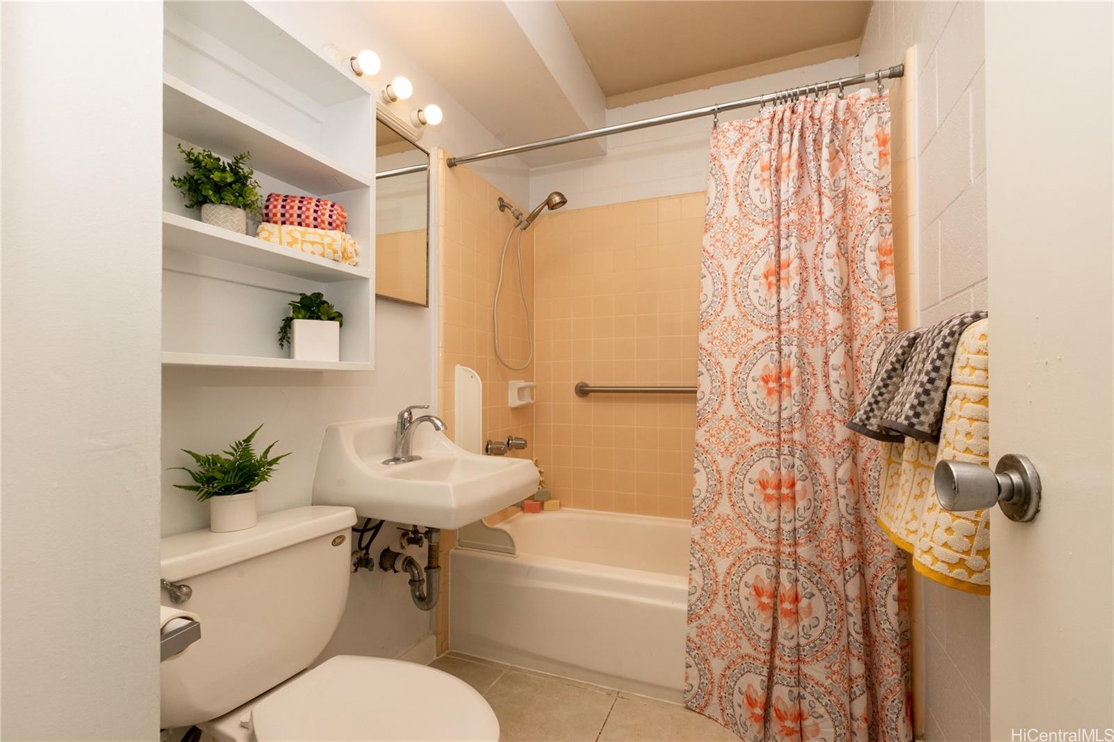 98-135 Lipoa Place, Unit 301 Aiea, HI 96701 - Photo 17 of 17 a bathroom with a sink toilet and shower