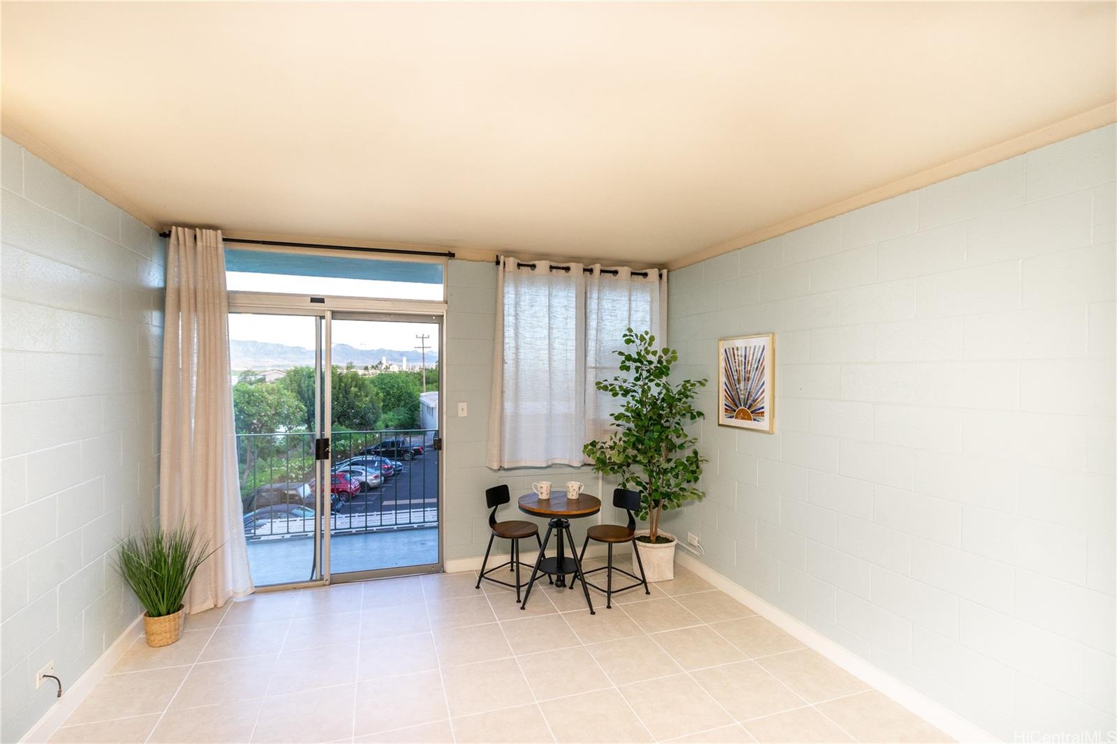 98-135 Lipoa Place, Unit 301 Aiea, HI 96701 - Photo 3 of 17 a workspace with furniture and a potted plant