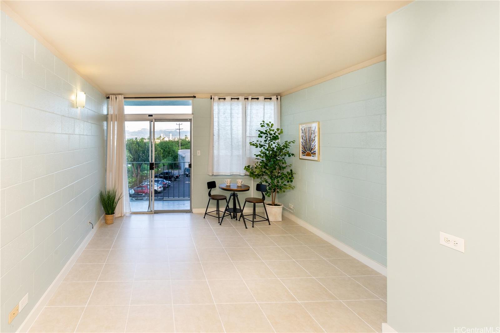 98-135 Lipoa Place, Unit 301 Aiea, HI 96701 - Photo 5 of 17 a living room with furniture and potted plant