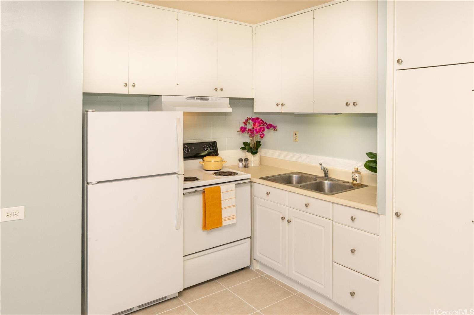 98-135 Lipoa Place, Unit 301 Aiea, HI 96701 - Photo 6 of 17 a utility room with cabinets washer and dryer