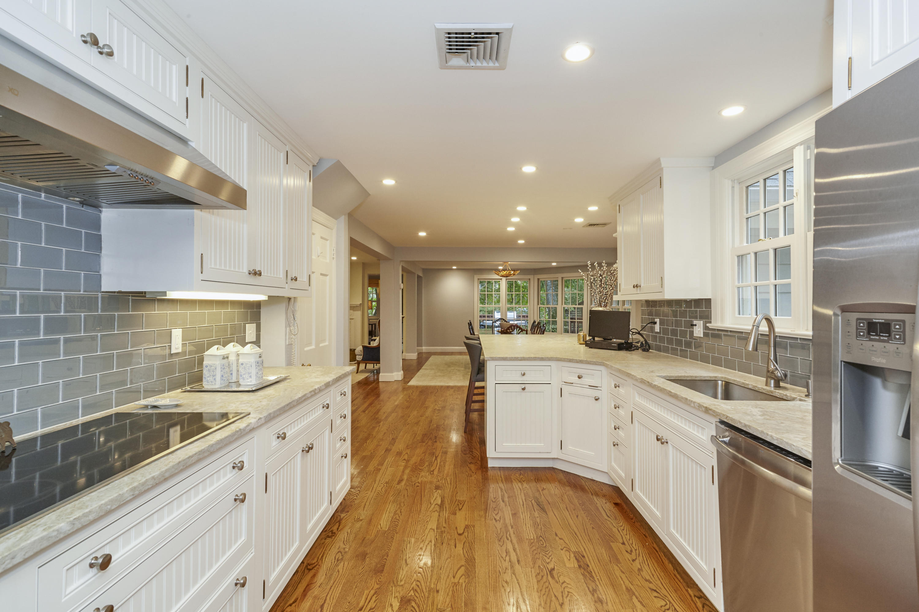 20 Homestead Road Darien, CT 06820 - Photo 19 of 48 a large kitchen with stainless steel appliances lots of counter space and wooden floor