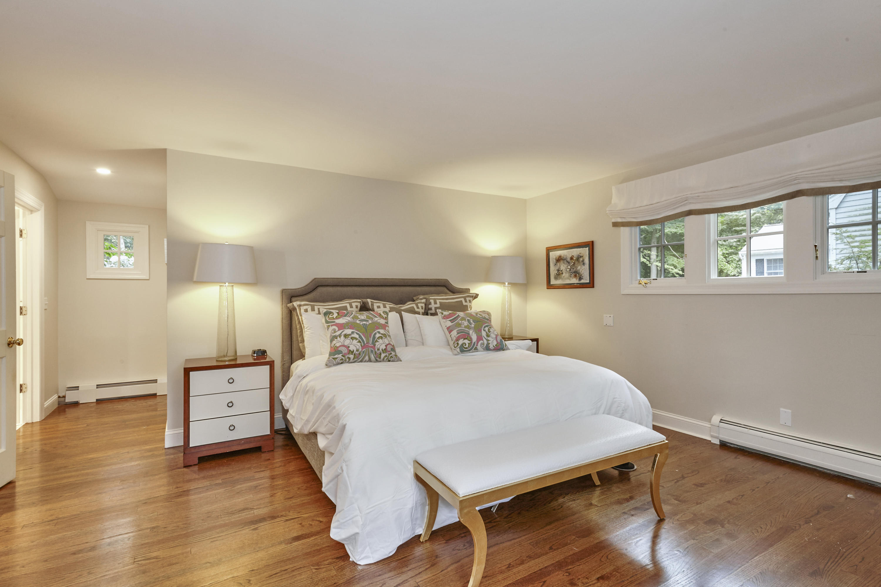 20 Homestead Road Darien, CT 06820 - Photo 29 of 48 a bedroom with a bed and a lamp