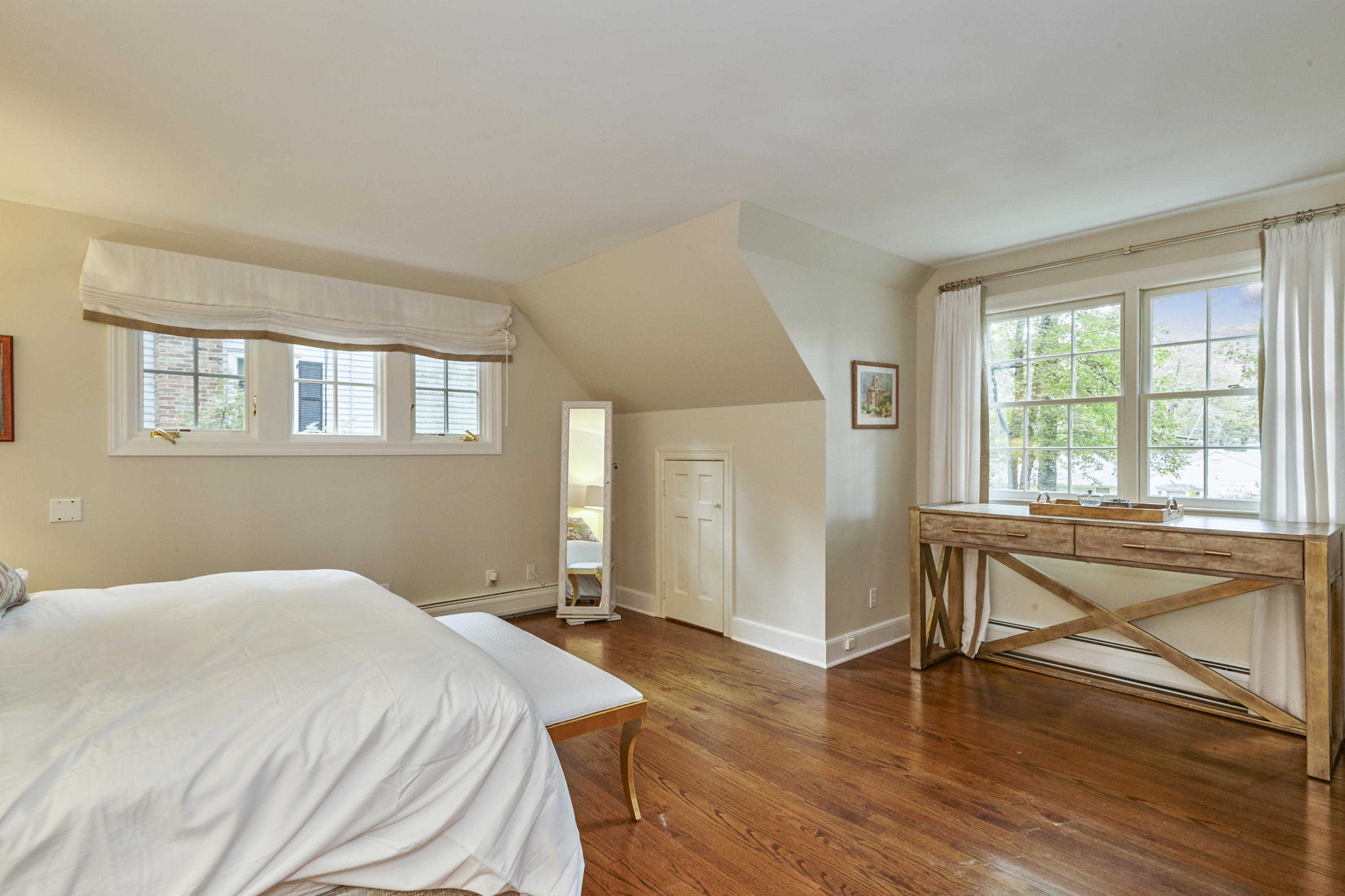 20 Homestead Road Darien, CT 06820 - Photo 31 of 48 a bedroom with a bed and wooden floor