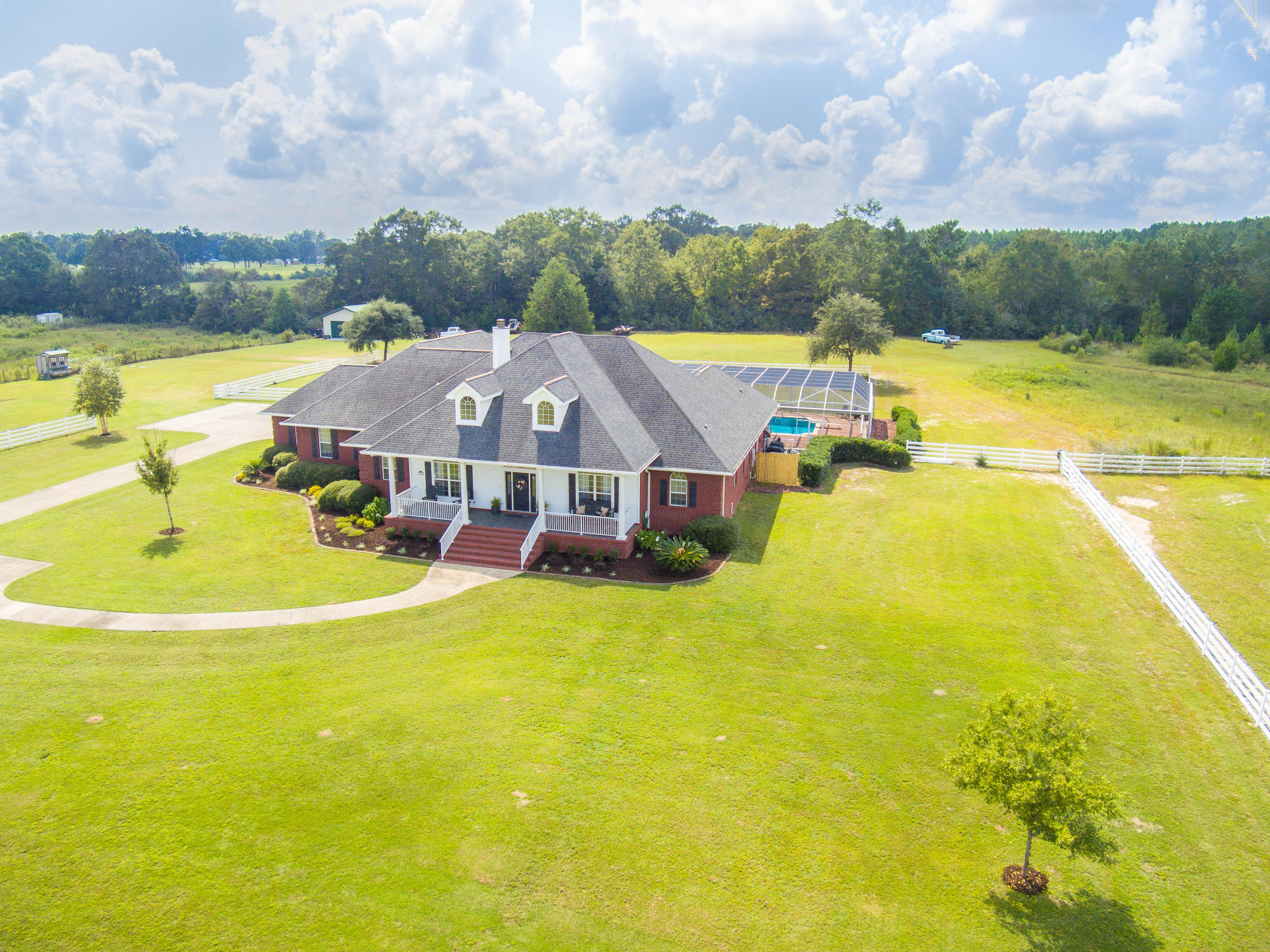 1498 Sky Ranch Lane Baker, FL 32531 - Photo 1 of 86 a view of a swimming pool with a patio