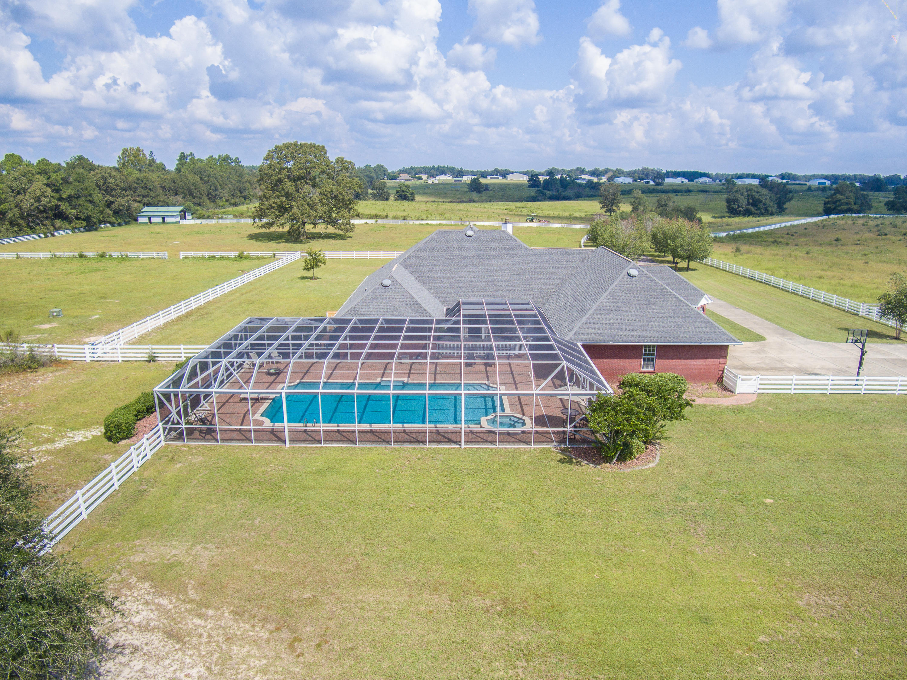 1498 Sky Ranch Lane Baker, FL 32531 - Photo 11 of 86 a view of an swimming pool and a yard