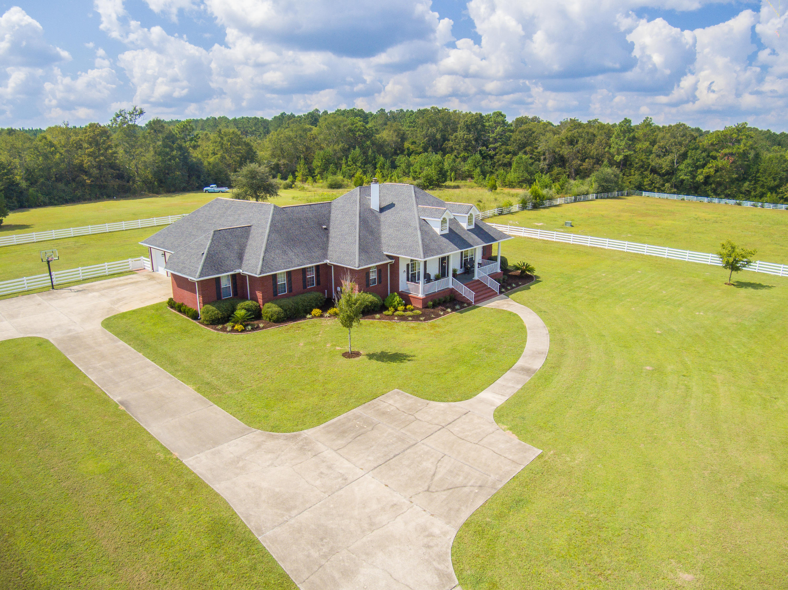 1498 Sky Ranch Lane Baker, FL 32531 - Photo 13 of 86 a view of a swimming pool with a yard and a large tree