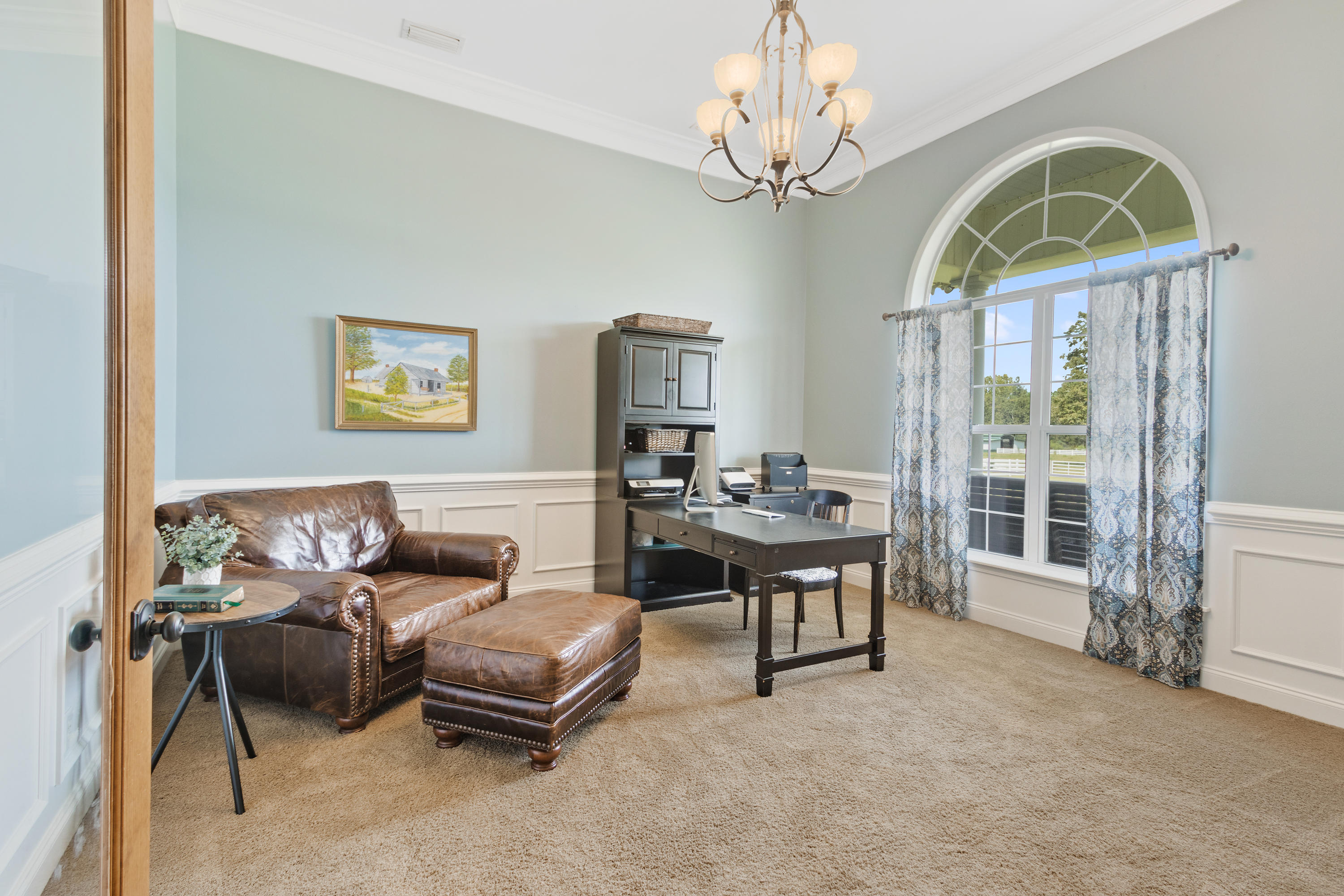 1498 Sky Ranch Lane Baker, FL 32531 - Photo 19 of 86 a living room with furniture a fireplace and a chandelier