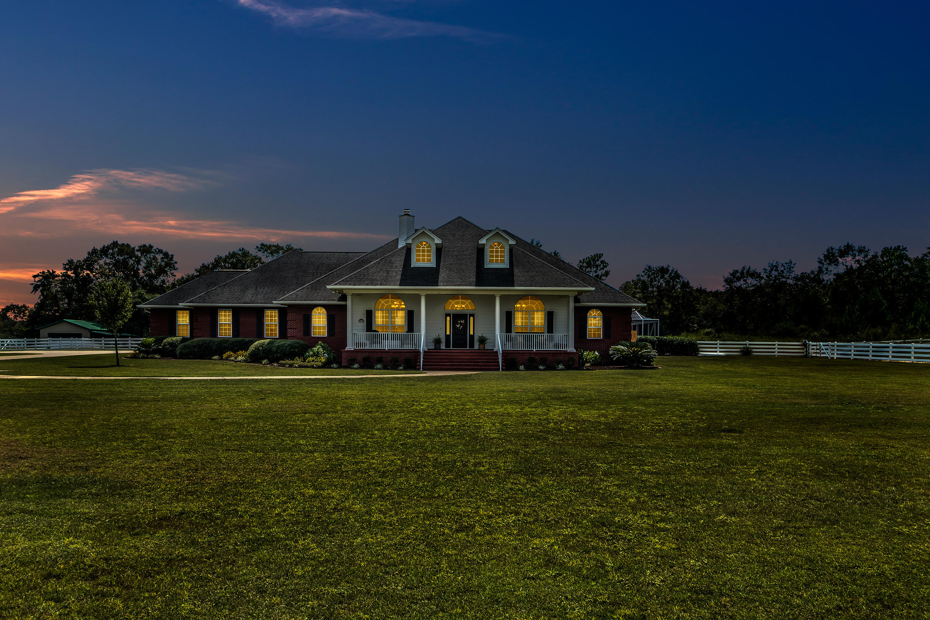 1498 Sky Ranch Lane Baker, FL 32531 - Photo 3 of 86 a front view of a house with a yard table and chairs