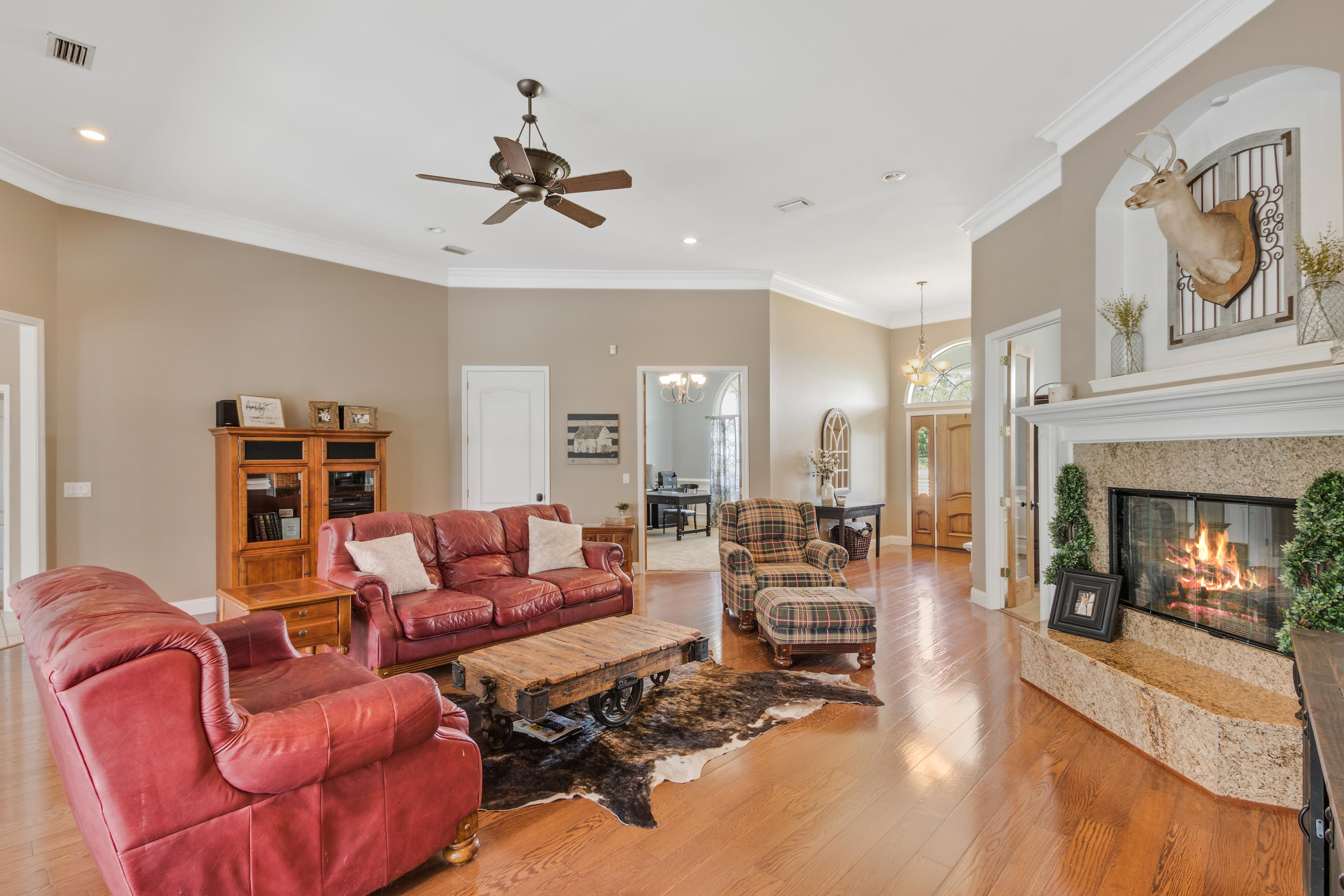 1498 Sky Ranch Lane Baker, FL 32531 - Photo 23 of 86 a living room with furniture fireplace and a fireplace