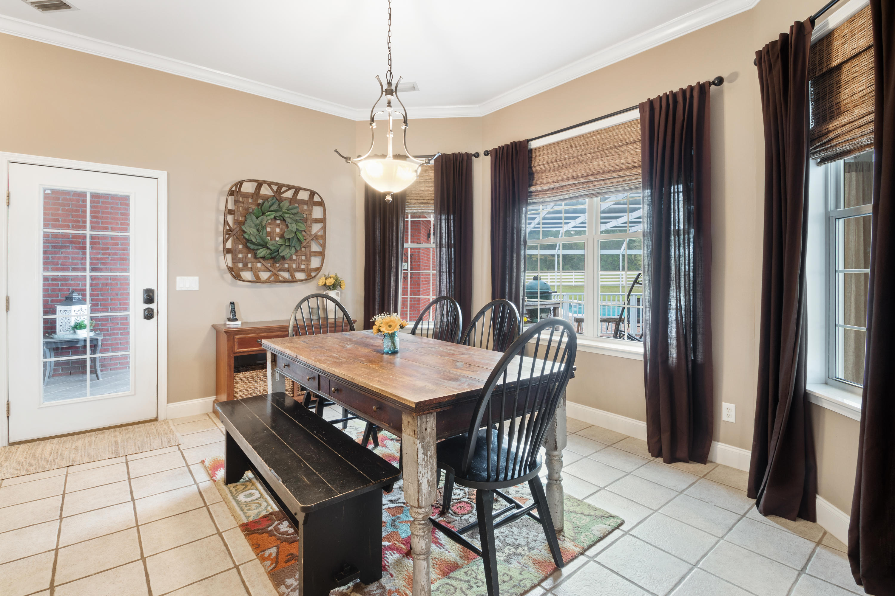 1498 Sky Ranch Lane Baker, FL 32531 - Photo 24 of 86 a view of a dining room with furniture window and outside view