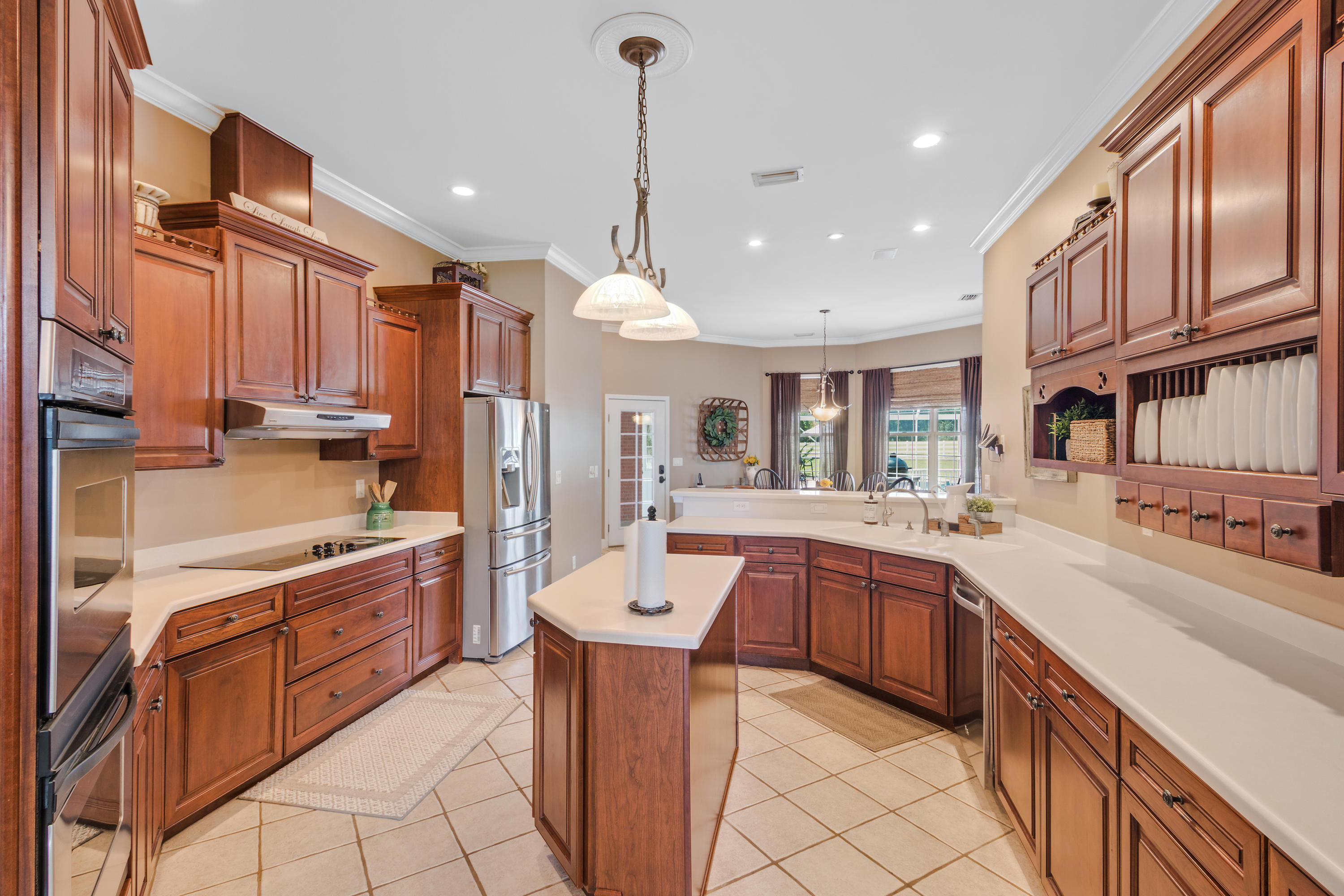 1498 Sky Ranch Lane Baker, FL 32531 - Photo 27 of 86 a large kitchen with stainless steel appliances lots of counter top space