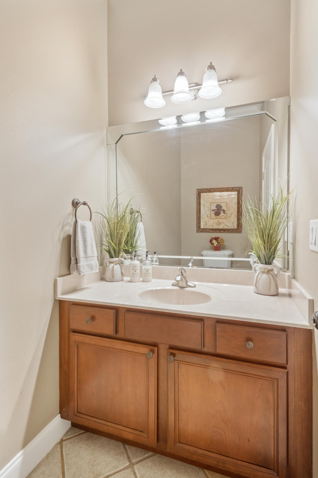 1498 Sky Ranch Lane Baker, FL 32531 - Photo 31 of 86 a bathroom with a sink a mirror and vanity