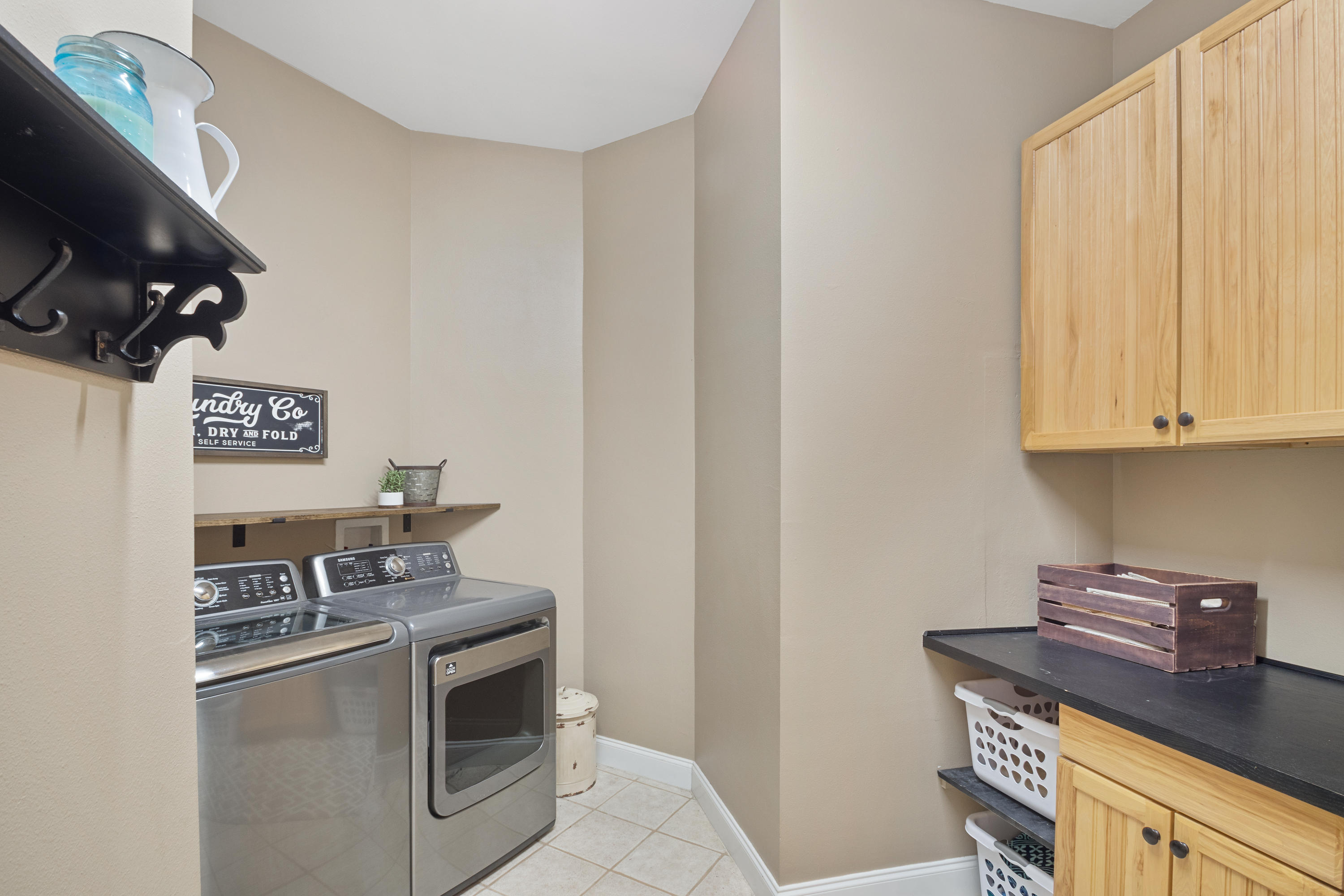 1498 Sky Ranch Lane Baker, FL 32531 - Photo 32 of 86 a kitchen with stainless steel appliances a stove a microwave and a refrigerator