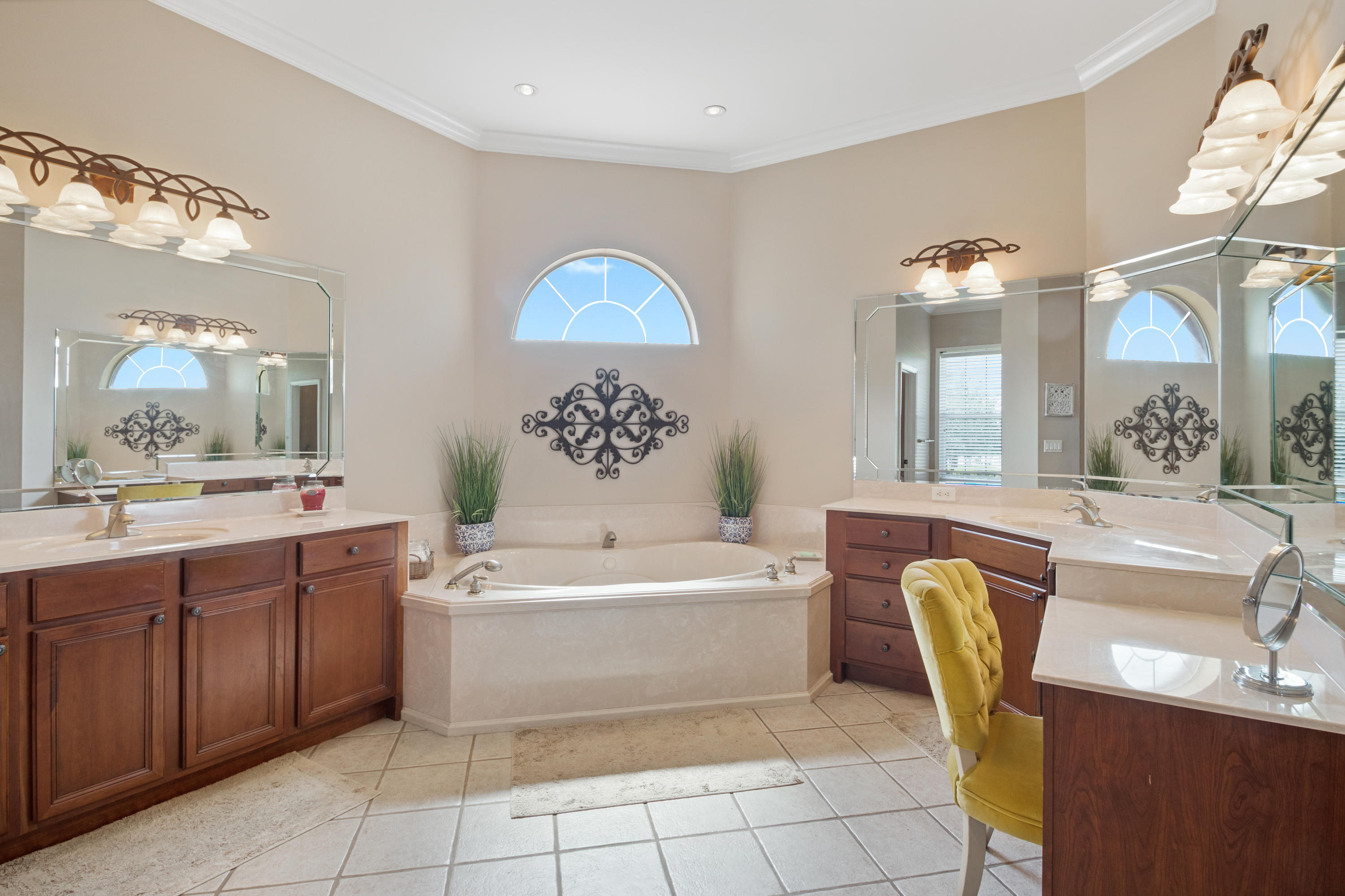 1498 Sky Ranch Lane Baker, FL 32531 - Photo 35 of 86 a bathroom with a sink a bathtub a mirror and a lamp