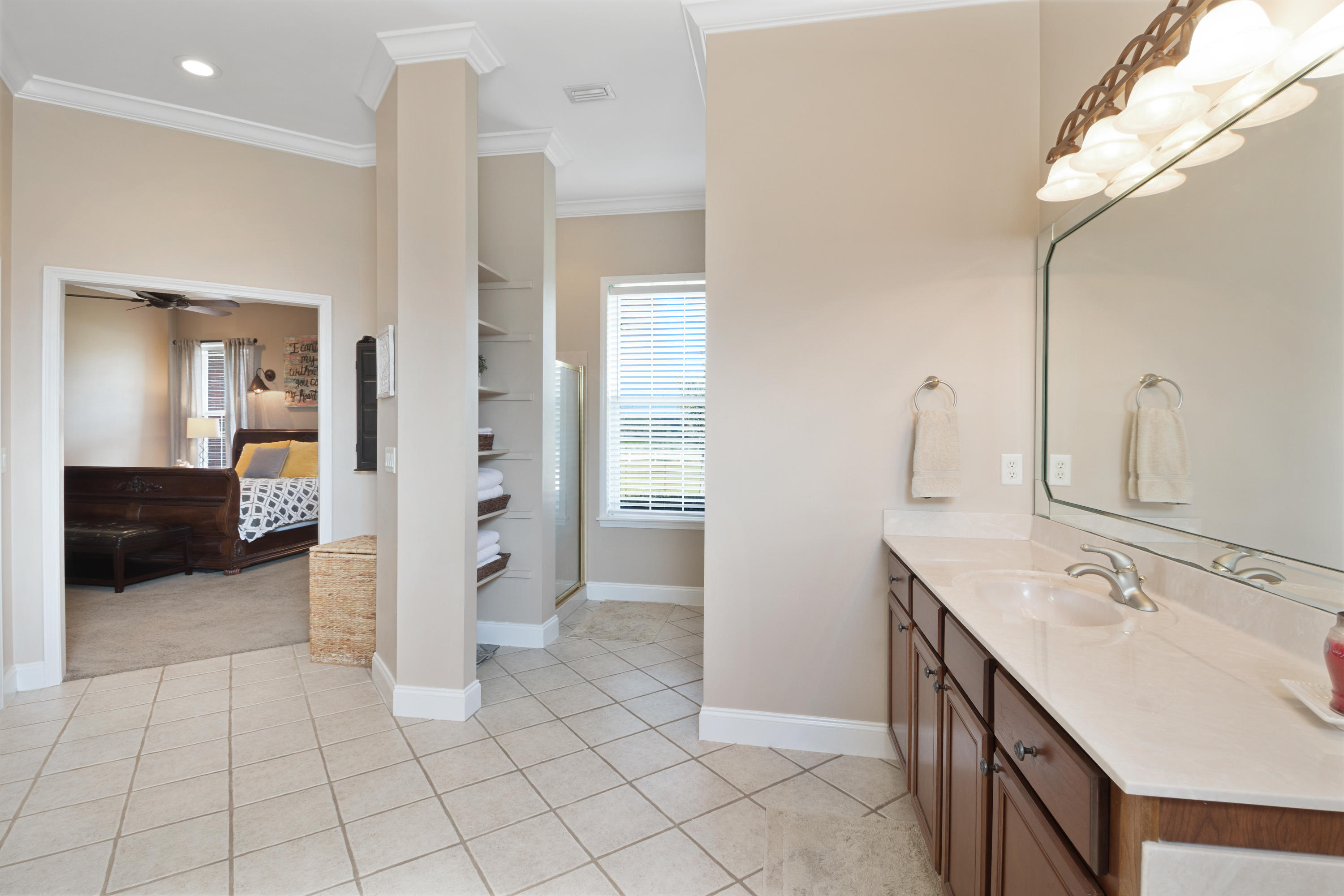 1498 Sky Ranch Lane Baker, FL 32531 - Photo 37 of 86 a spacious bathroom with a sink and a mirror