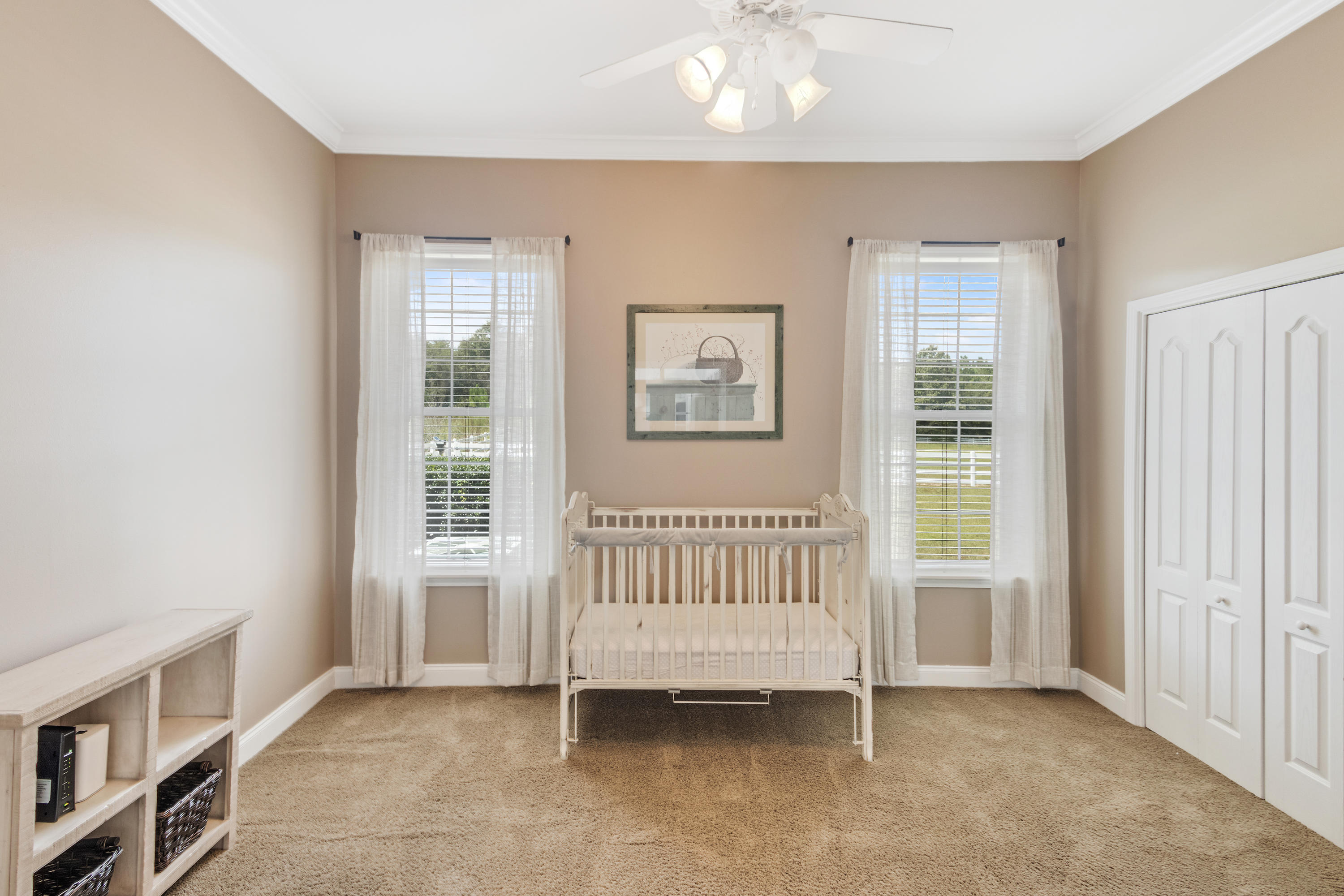 1498 Sky Ranch Lane Baker, FL 32531 - Photo 40 of 86 a view of a bedroom with furniture window and wooden floor