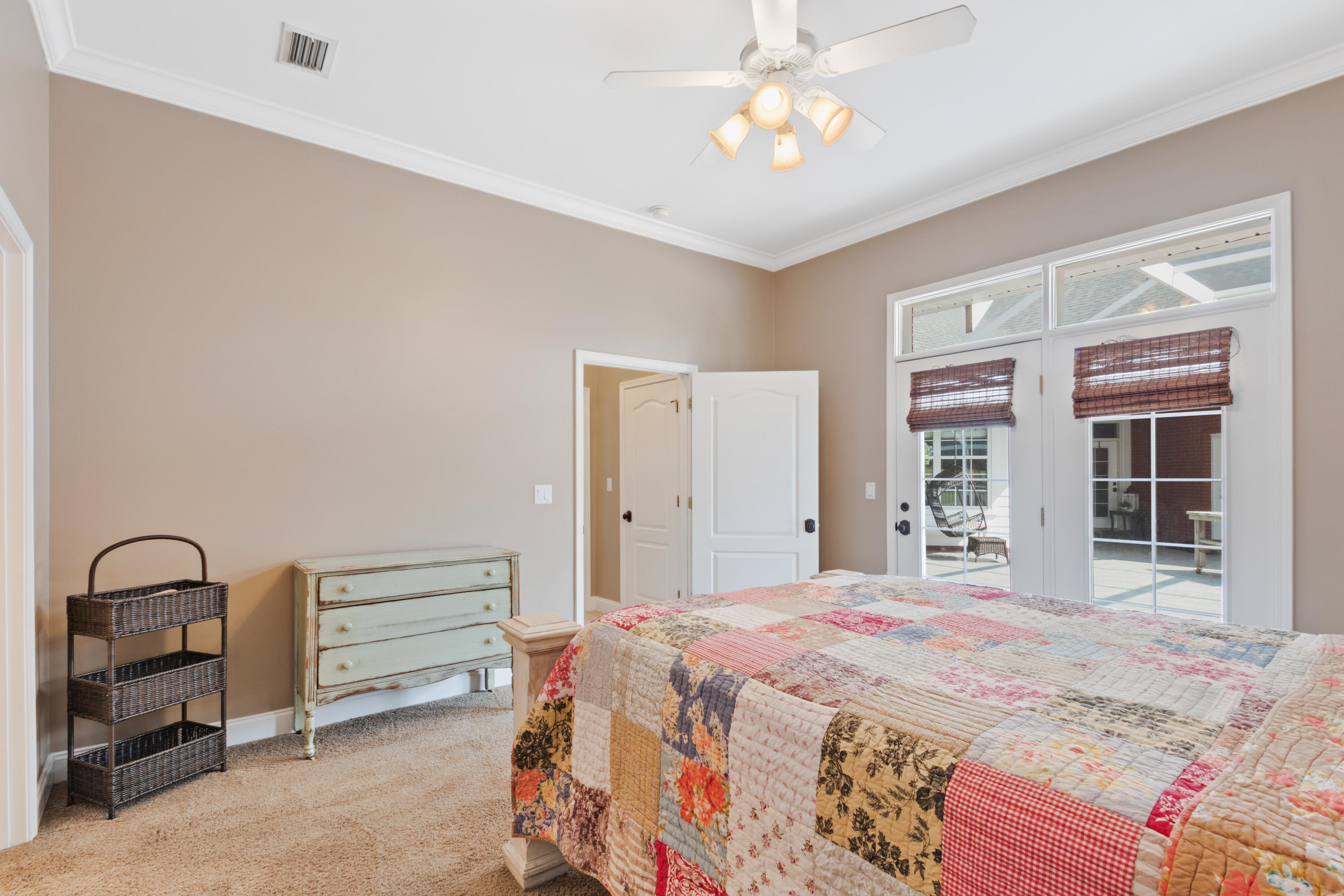 1498 Sky Ranch Lane Baker, FL 32531 - Photo 43 of 86 a bedroom with a bed and a chandelier