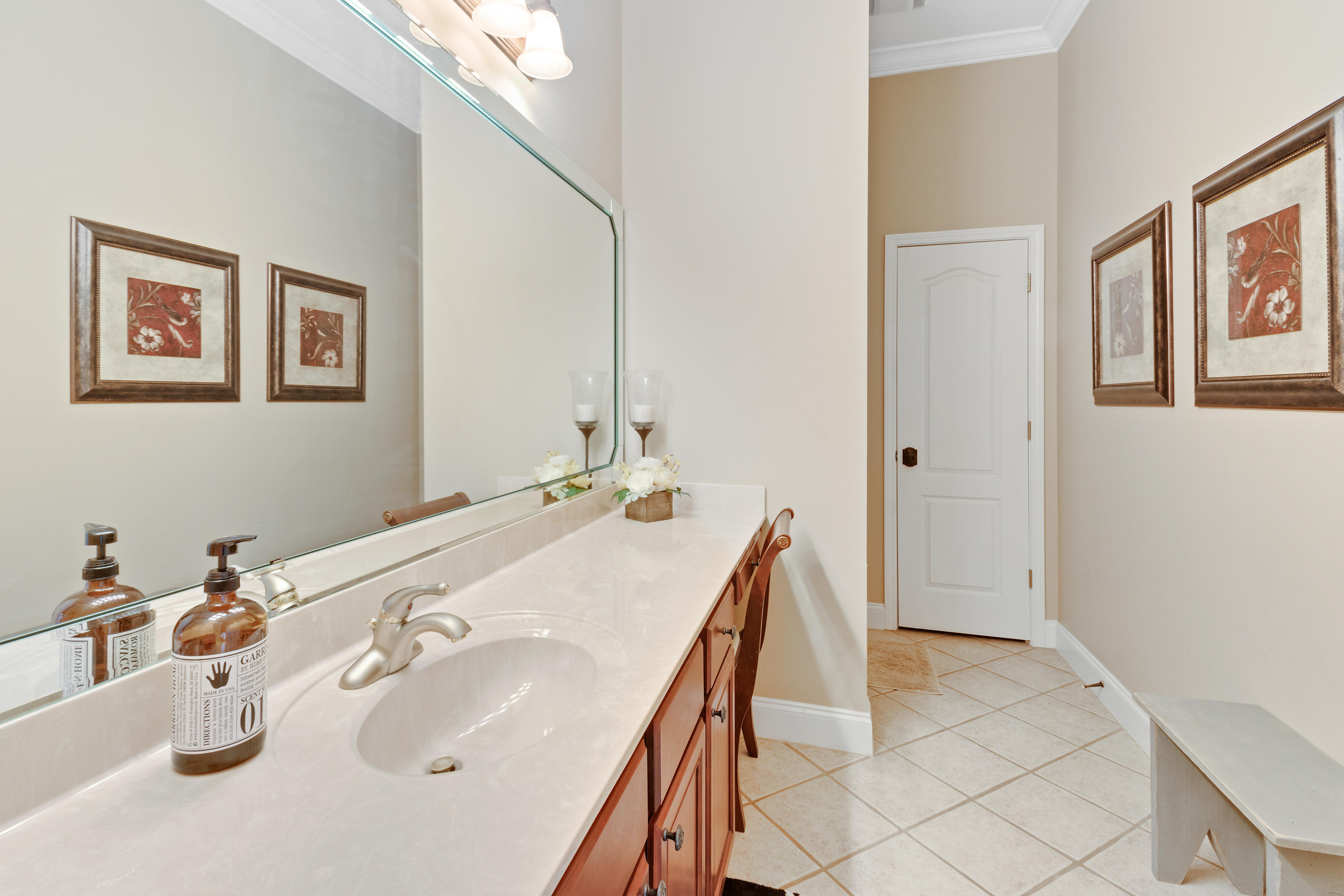1498 Sky Ranch Lane Baker, FL 32531 - Photo 46 of 86 a bathroom with a sink and a mirror