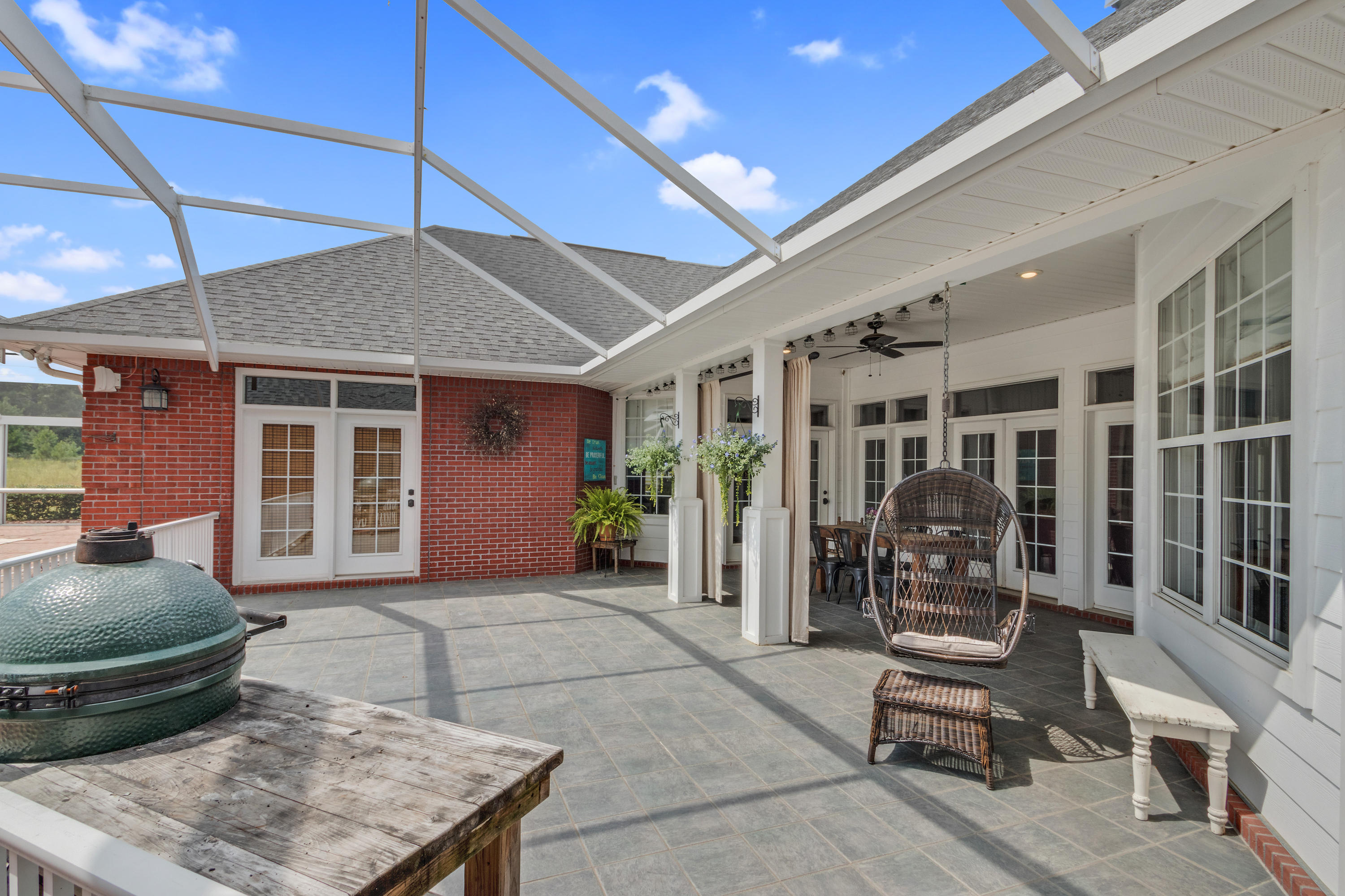 1498 Sky Ranch Lane Baker, FL 32531 - Photo 61 of 86 a view of a house with backyard sitting area and porch