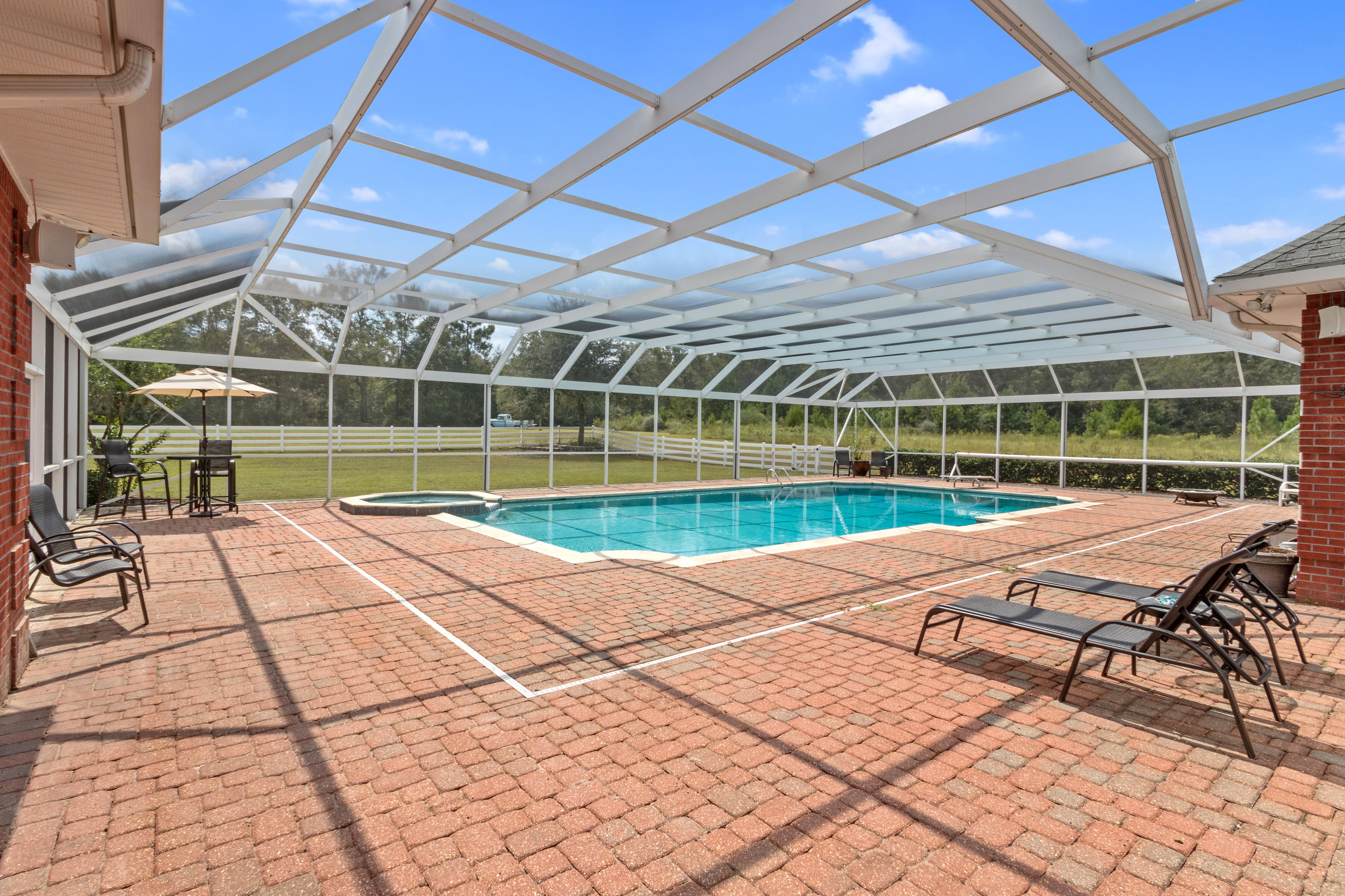 1498 Sky Ranch Lane Baker, FL 32531 - Photo 64 of 86 a house with swimming pool in front of it