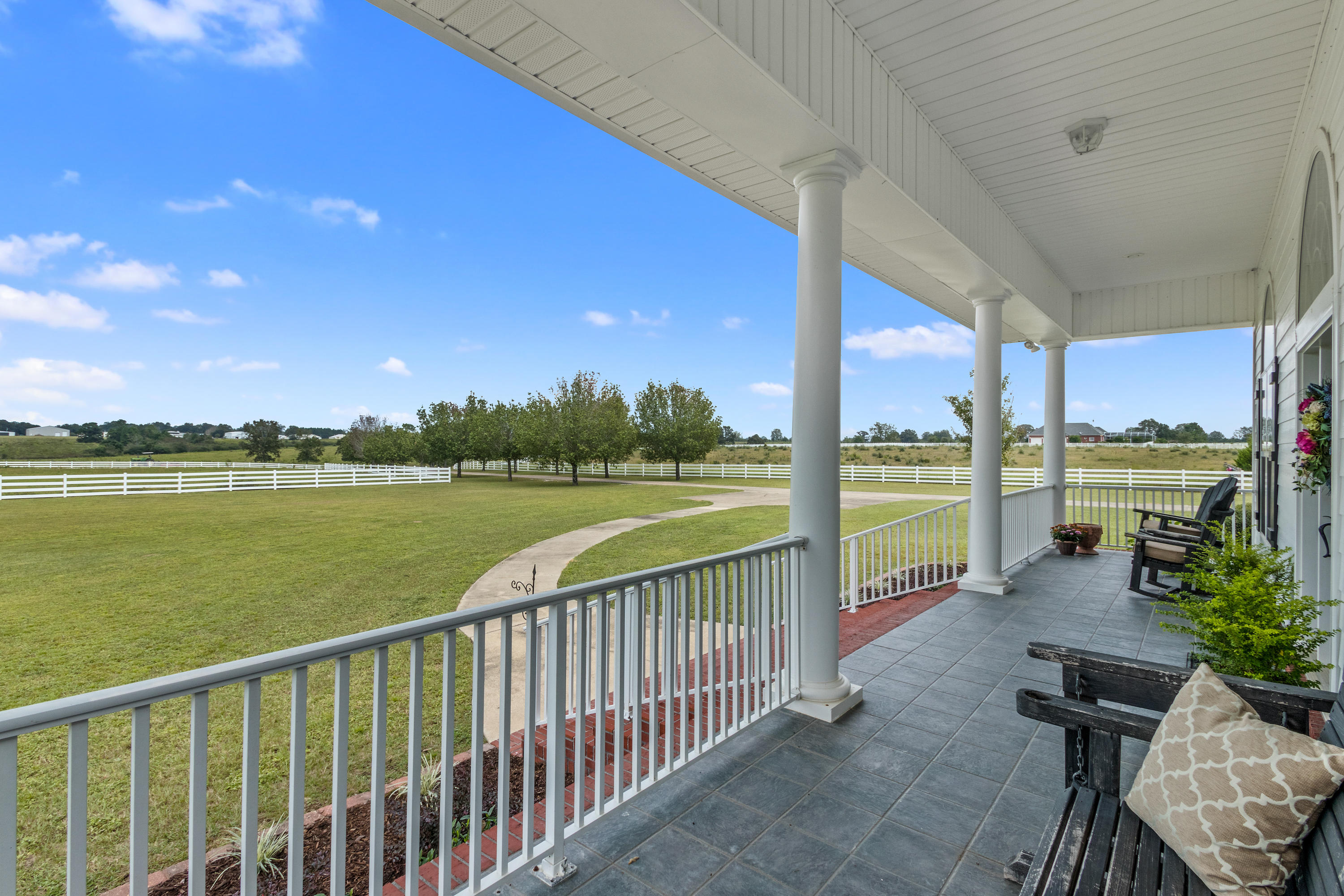 1498 Sky Ranch Lane Baker, FL 32531 - Photo 8 of 86 a view of a balcony with lake view and a table