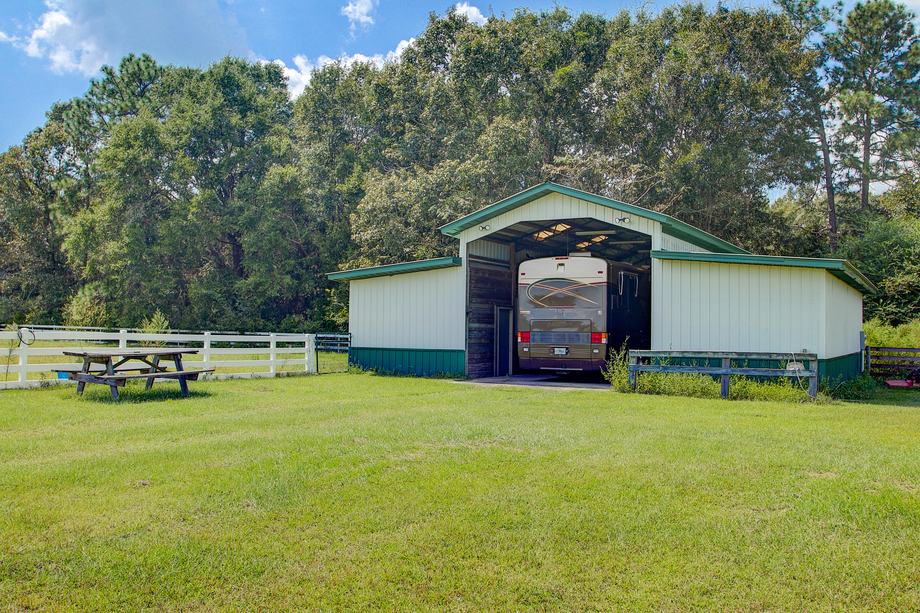 1498 Sky Ranch Lane Baker, FL 32531 - Photo 71 of 86 a house view with a sitting space and garden