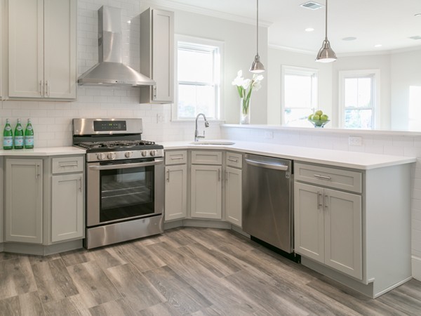a kitchen with a stove oven and sink