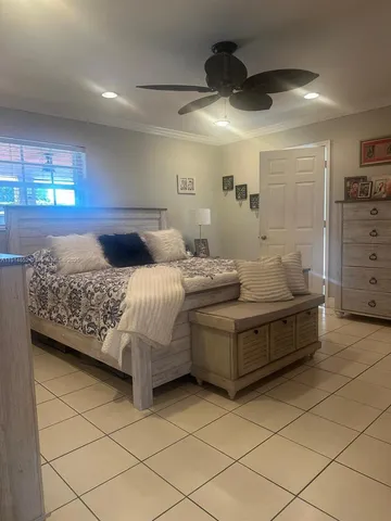 a bedroom with a bed and a walk in closet