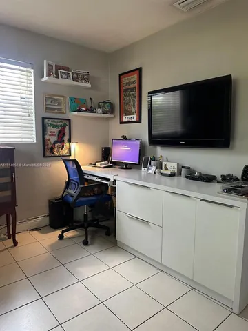 a room with furniture and a flat screen tv