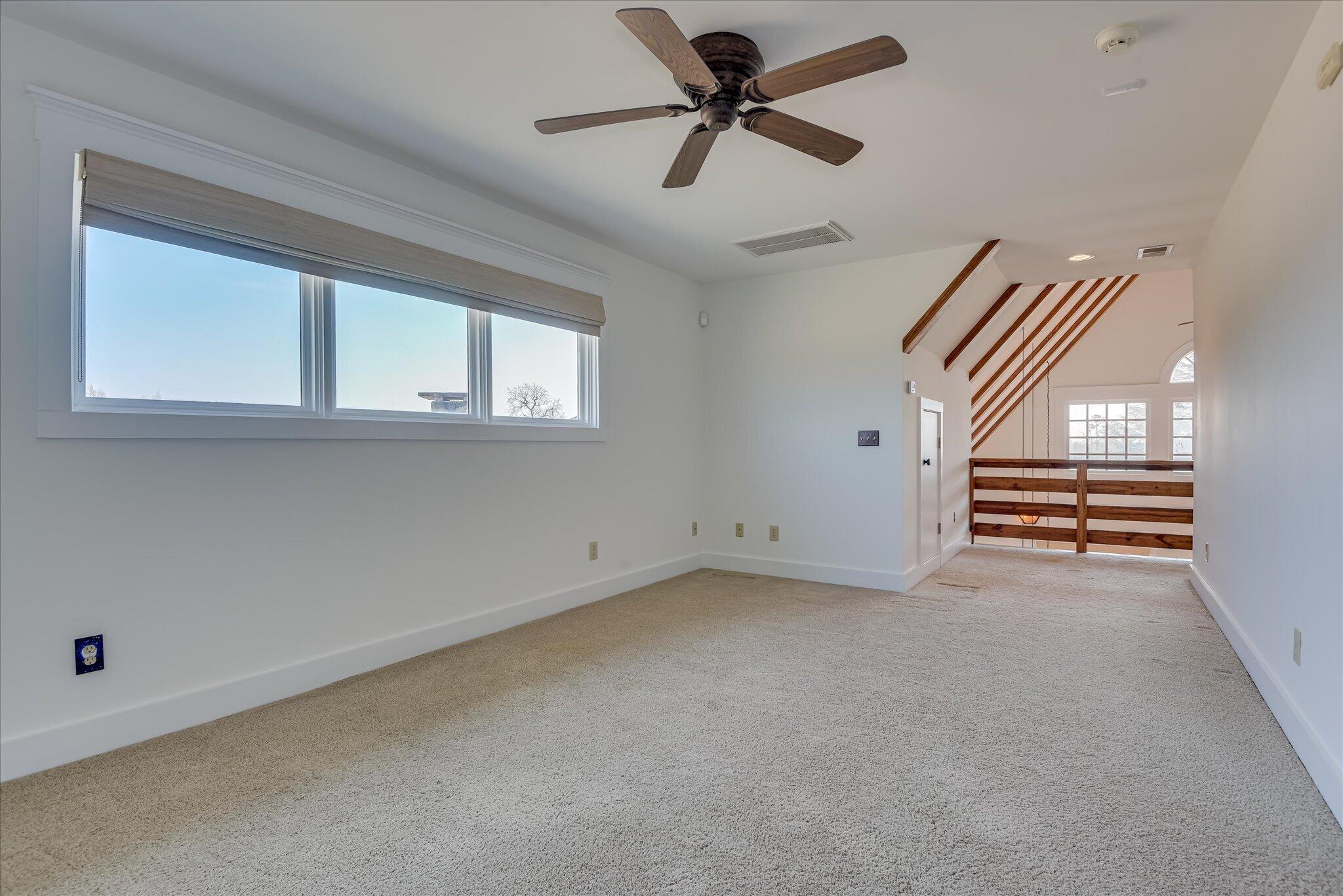 1063 Colbert Bridge Road Aiken, SC 29803 - Photo 18 of 68 a view of room with stairs and a ceiling fan