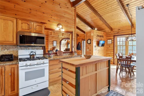 a kitchen with a stove a sink and a refrigerator